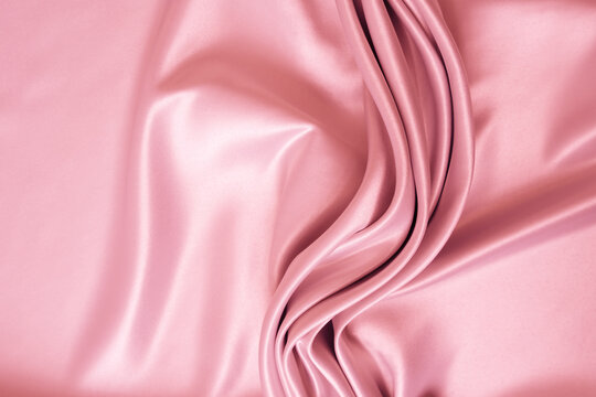 Wall Mural - Beautiful elegant wavy light pink satin silk luxury cloth fabric texture with monochrome background design