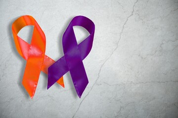 Wall Mural - February awareness month campaign with purple and orange ribbon concept