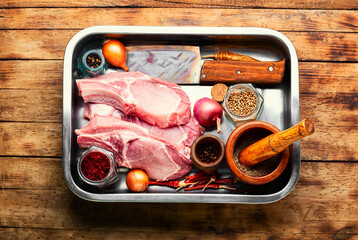 Wall Mural - Raw pork on old wooden background