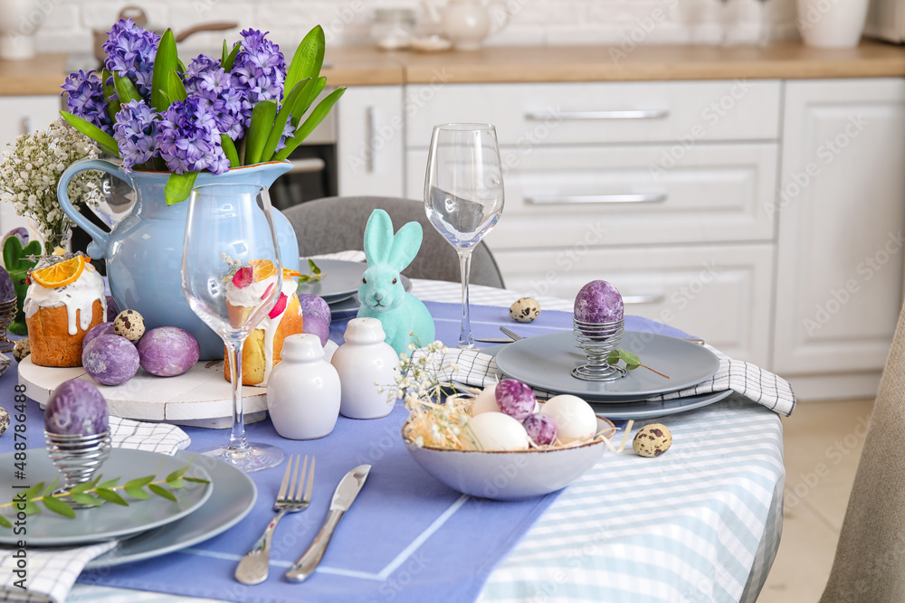 Dining table served for Easter celebration in kitchen