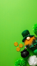 Happy St Patricks Day Vertical Banner Design. Leprechaun With Pot Of Gold On Green Background. Flat Lay, Top View, Copy Space.