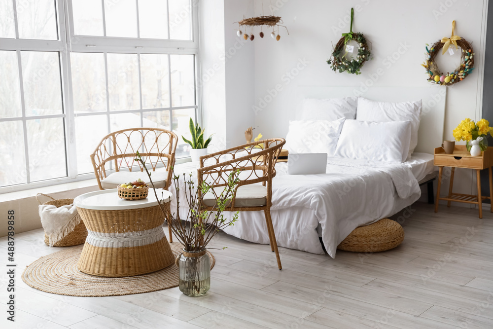 Interior of bedroom with stylish Easter decor
