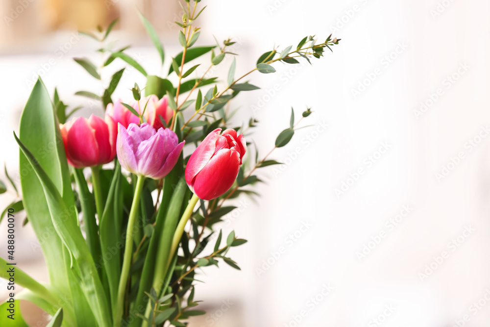 Bouquet of beautiful flowers on light background, closeup