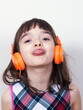© gmstockstudio - Little girl using the earphones