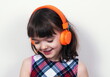 © gmstockstudio - Little girl using the earphones
