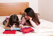 © gmstockstudio - Mom with the daughter reading together