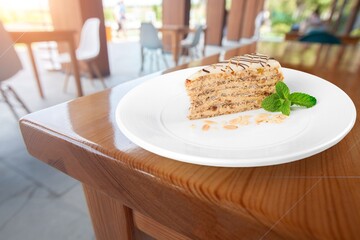 Wall Mural - Honey cake slice on white plate