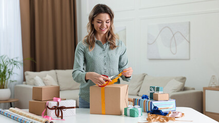 Poster - Beautiful young woman wrapping gift at table in living room