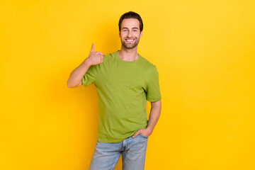 Wall Mural - Photo of cool beard young guy show thumb up wear t-shirt jeans isolated on yellow color background