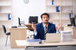 © Elnur - Young male employee working in the office