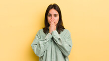 Young Hispanic Woman Feeling Worried, Upset And Scared, Covering Mouth With Hands, Looking Anxious And Having Messed Up
