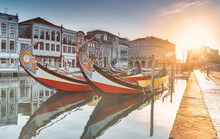 View Of The Main Channel Of The Ria De Aveiro In Portugal With The Traditional Moliceiros.