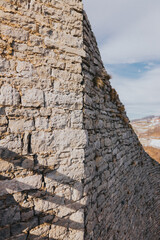 Canvas Print - A rough aged stone wall