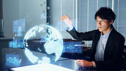 Aufkleber - Asian man watching hologram of the earth in dark office. Global network.