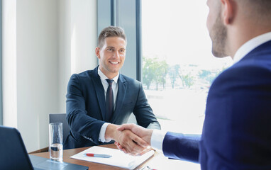 Poster - Business handshake. Two businessman shaking hands in the office