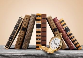 Wall Mural - Vintage pocket watch and books. Vintage background Concept of time history.