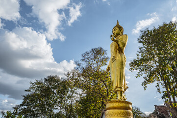 Golden buddha statue on the mountain at Wat Phrathat Khao Noi at nan thailand.Wat Phra That Khao Noi temple was built in 1487 and houses a relic of Buddha in its main chedi