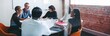 © Jacob Lund - Smiling businesspeople sitting together in a meeting room