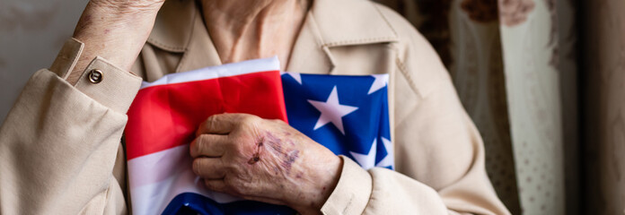 Senior who is proud to be an American, very old woman with american flag.