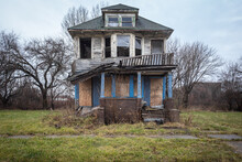 Head On View Of An Abandoned House In Heavy Disrepair