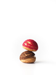 Canvas Print - choux pastry with red and brown craquelin on white background