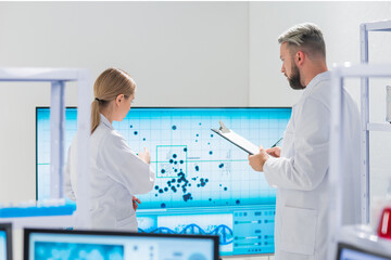 Wall Mural - professional team of scientists is working on a vaccine in a modern scientific research laboratory. 
