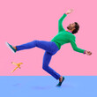 © Alexandra/peopleimages.com - Watch your step.... Humorous shot of a young man slipping on a banana peel agains a colorful studio background.