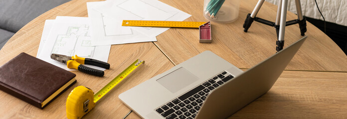 Tools and papers with sketches on the table
