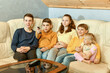 © Tetiana - Five children watch TV and switch channels with a remote control