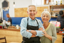 Proud To Say Were Open For Business. Shot Of A Senior Couple Running A Small Business Together.
