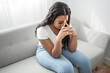 © Louis-Paul Photo - Stressed miserable black woman suffer from grief problem, depressed lonely upset african girl crying alone on sofa