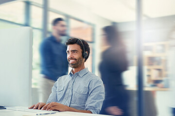 Canvas Print - Its another busy and productive day in the office. Cropped shot of a call centre agent working in a busy office.