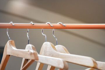 Wall Mural - Wooden hangers hung on a light brown or tile bar