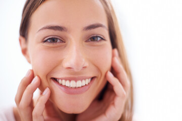 Sticker - Youthful radiance. A young woman smiling at the camera - closeup.