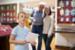 © JackF - Family in museum, son exploring artworks, his parents standing on background