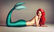 Shes a catch. Shot of a beautiful red-headed mermaid lying down.