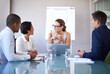 © T Hover/peopleimages.com - Annual marketing meeting. A group of businesspeople having a meeting in a boardroom.