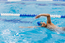 Latin Young Man Swimmer Athlete Wearing Cap And Goggles In A Swimming Training Holding On Starting Block In The Pool In Mexico Latin America