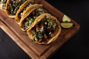 Wall Mural - Tacos de Suadero. Fried meat in a corn tortilla. Street food from CDMX, Mexico, traditionally accompanied with cilantro, onion and spicy red sauce