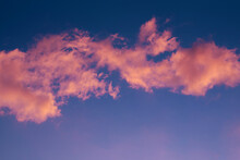 Pink Clouds On The Blue Sky Background