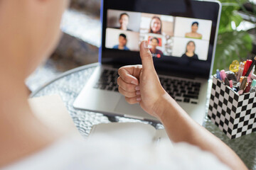 Canvas Print - Online studying concept the college students showing a hand sign as giving opinion in front of online group of his project friends after they have discussed about the project