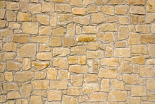 Texture Of Natural Yellow Stone Brick Wall