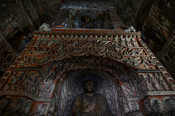 Poster - Low-angle shot of the Buddha statues in the Chinese Yungang Grottoes temple in Datong City