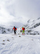 © Pavel Kašák - Ski touring couple hiking up a summit in the alps. Concepts: adventure, achievement, courage, determination, extreme sport