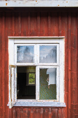 Wall Mural - Open window on an old deserted cottage