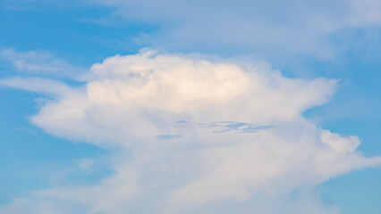 Wall Mural - Big white cloud on blue sky.