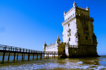 Canvas Print - Beautiful view of the Belem Tower, Fortification in Lisbon, Portugal on the water with a sunny sky