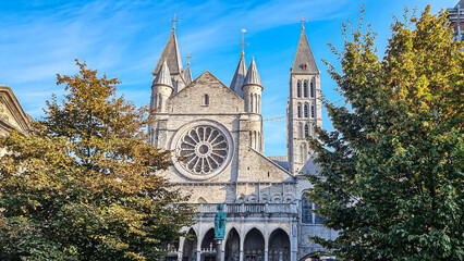 Poster - Beautiful shot of the catholic cathedral of worship with 5 towers behind green trees