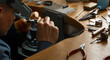 Goldsmith jeweler smoothing rough parts of pieces of jeweller. Close up cropped photo. Gold jewelry production concept.