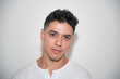 © Jeza - nice guy, dark-haired, white test, white t-shirt, looking straight ahead, neutral background